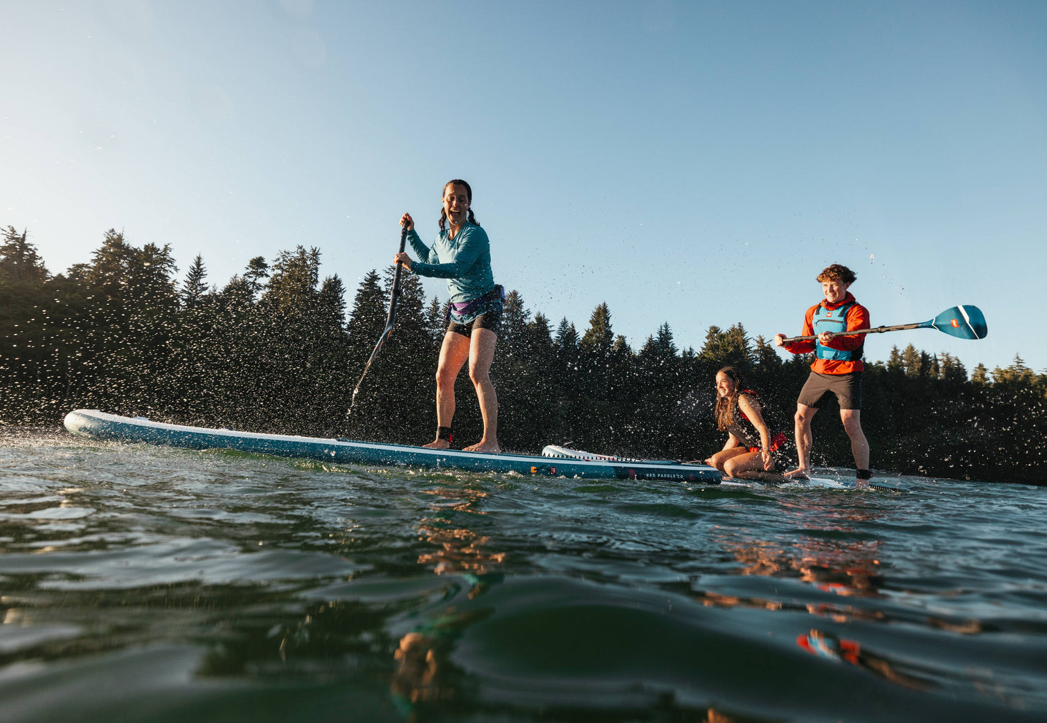 People paddleboarding on open water